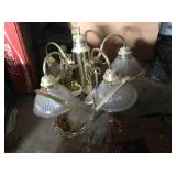 One of a pair of four-light chandeliers