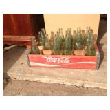 Vintage wooden Coca-Cola carrier, full of bottles