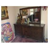 Dresser with mirror and hidden drawers.
