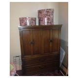 Armoire with drawers inside.