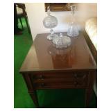 End table with crystal pieces.