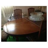 Dining room table with cane chairs.