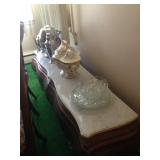 Long, low stone-topped sideboard.