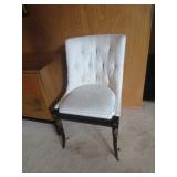 One of a pair of white side chairs