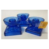 THREE COBALT GLASS CANDLE HOLDERS