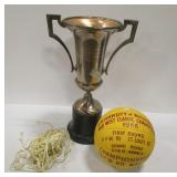 U of W 21" TALL CHAMPIONSHIP TROPHY AND A 1966 BASKET BALL. From the collection of Mac Duckworth