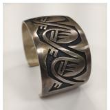 Hopi silver overlay bear paw cuff bracelet