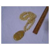 carved yellow jade necklace