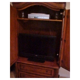 T V SET IN ARMOIRE