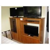 Enteertainment unit $75, three 32 inch flat screen TV