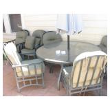 Outdoor patio set with glass table, umbrella and 6 heavy duty chairs $300