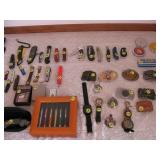 Assorted belt buckles and knives