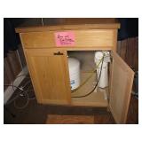 Ice maker includes osmosis unit inside a nice custom cabinet 