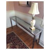 silver and glass table and mirror