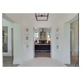 Series of 12 ink on paper designs and oil on canvas over the fireplace by MARCIA OLIVER. 