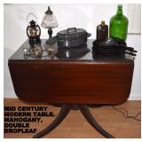 MID CENTURY MODERN DBL DROPLEAF TABLE. ALSO SELLING MATCHING CHINA CABINET.
