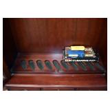 INTERIOR OF THE GUN CABINET. HOLDS 10 LONG GUNS