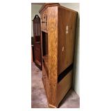 SIDE VIEW OF CORNER CABINET PULLED AWAY FROM THE WALL. ALL WOOD CONSTRUCTION.