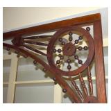 CLOSEUP OF THE HANDCRAFTED ANTIQUE TRIMWORK