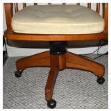 THE CHAIR BASE, SHOWING THE CASTERS