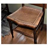 CLOSEUP OF SEAT SHOWING THE "EYE" CANING