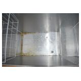 INTERIOR OF FREEZER INCLUDES WIRE BASKET FOR SMALLS