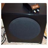 A SPEAKER TO THE THEATER SOUND SYSTEM