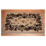 ONE OF THE THROW RUGS