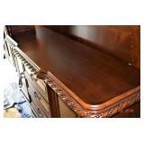 THE HANDCRAFTED CARVING IS REPLICATED ON THE CREDENZA