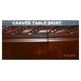 FINELY CARVED SKIRT ON TABLE AND ON LEAF