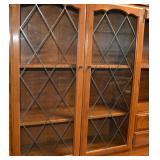 GLASS DOORS WITH DECORATIVE METAL GRILLE INSETS