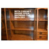 SHOWING THE SHELVES BEHIND THE GLASS DOORS