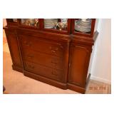 DOORS/DRAWERS CLOSED. STEP-BACK CENTER SECTION IS FLANKED BY CARVED-TOP BALUSTERS