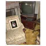 MCM UPHOLSTERED CHAIR. TV. MARBLETOP LAMPTABLE TO THE RIGHT