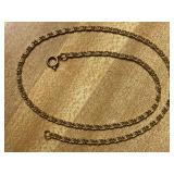 THIS 24" CHAIN IS SIGNED 14K. METAL IS WHITE GOLD COLOR, NOT YELLOW