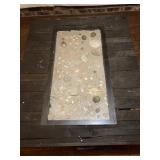 SHOWING THE CENTER WITH SAND AND SEASHELLS