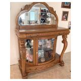 ANTIQUE REPRODUCTION CABINET WITH MIRRORED BACK, FRAMED SHAPED MIRROR ON TOP