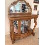 ANTIQUE REPRODUCTION CABINET WITH MIRRORED BACK, FRAMED SHAPED MIRROR ON TOP