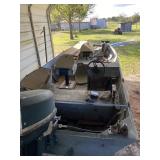 BACK VIEW OF BOAT. STORED UNDER COVER