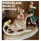 WONDERFUL GERMAN VICTORIAN SLEIGHING COUPLE FIGURINE. NOTE THE SWAN SLEIGH!!