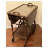 THE SERVING CART CLOSED WITH TRAY ATOP