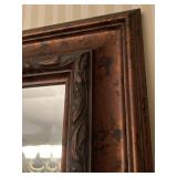 THE FRAME ON THE LARGE MIRROR