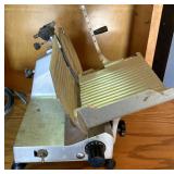 LECTRIC MEAT SLICER. see auction listing