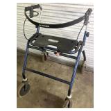 WALKER WITH BRAKES AND SEAT.