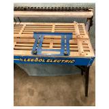 ELECTRIC TILE SAW ON WORK TABLE