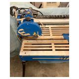 ELECTRIC TILE SAW ON WORK TABLE