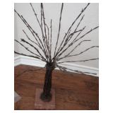 BARBED WIRE TREE MOUNTED ON STONE BASE