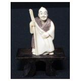 Netsuke Cloth Merchant On Wood Base