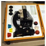Vintage Tasco Battery Powered Microscope Including Magnification Lenses, Stain, Slides And Wood Carr