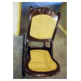 Carved Rose Back Collapsible Rocking Chair With Cane Seat And Back